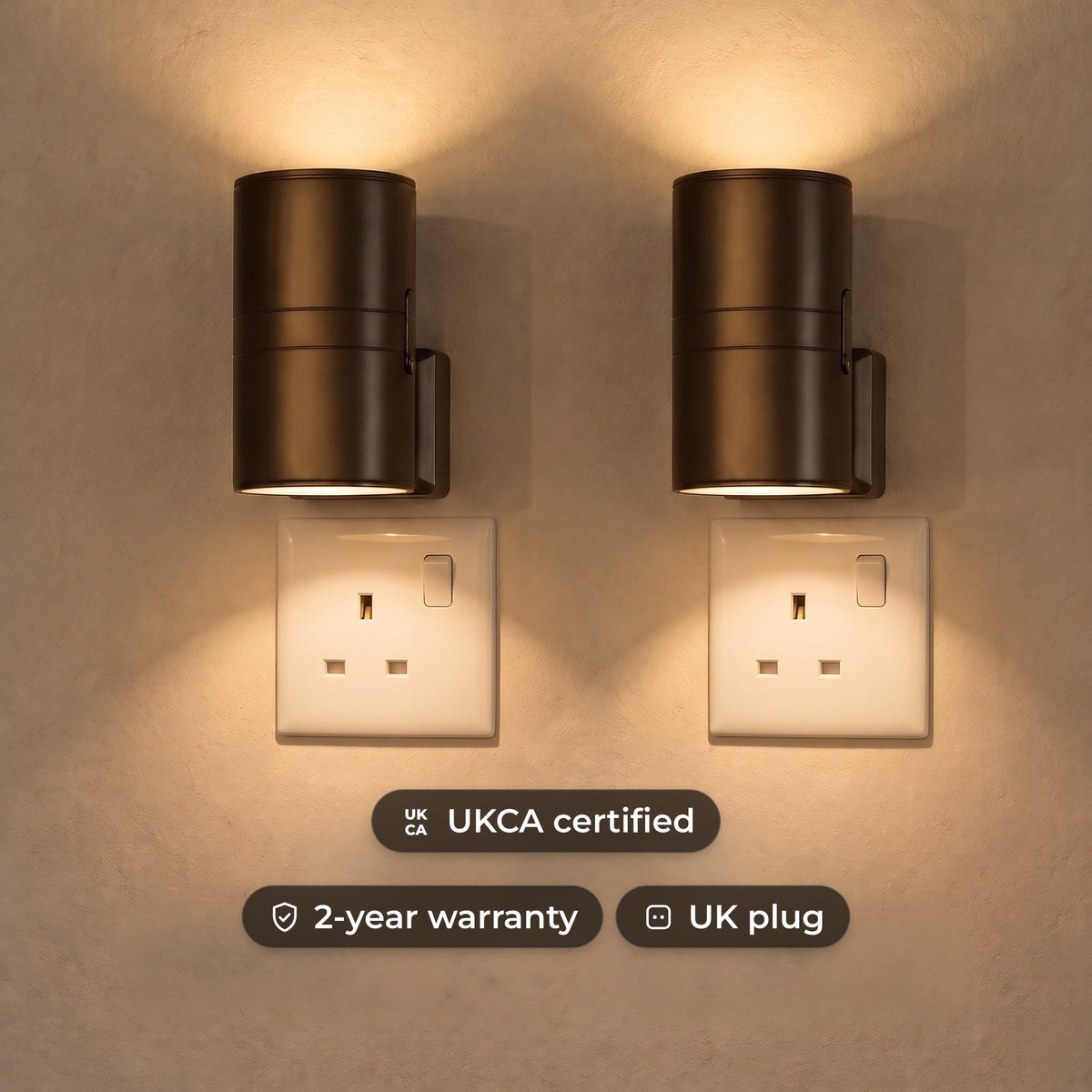Plug-in up and down LED wall lights in black, glowing warm white